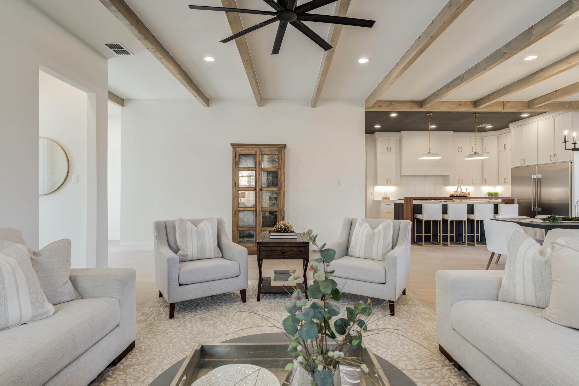 3606 144th Street Lubbock, TX 79423 - Photo 5 of 67 a living room with furniture kitchen view and a chandelier