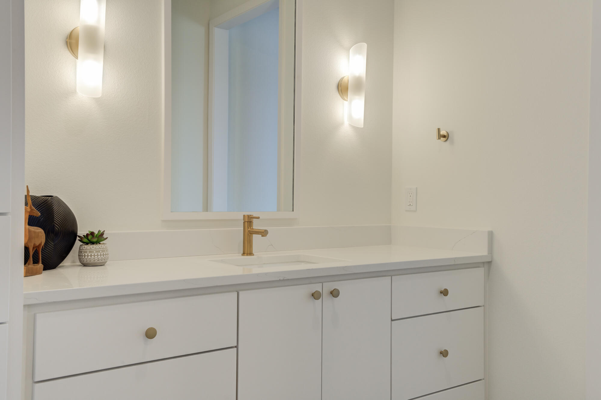 3606 144th Street Lubbock, TX 79423 - Photo 53 of 67 a bathroom with a sink and a mirror