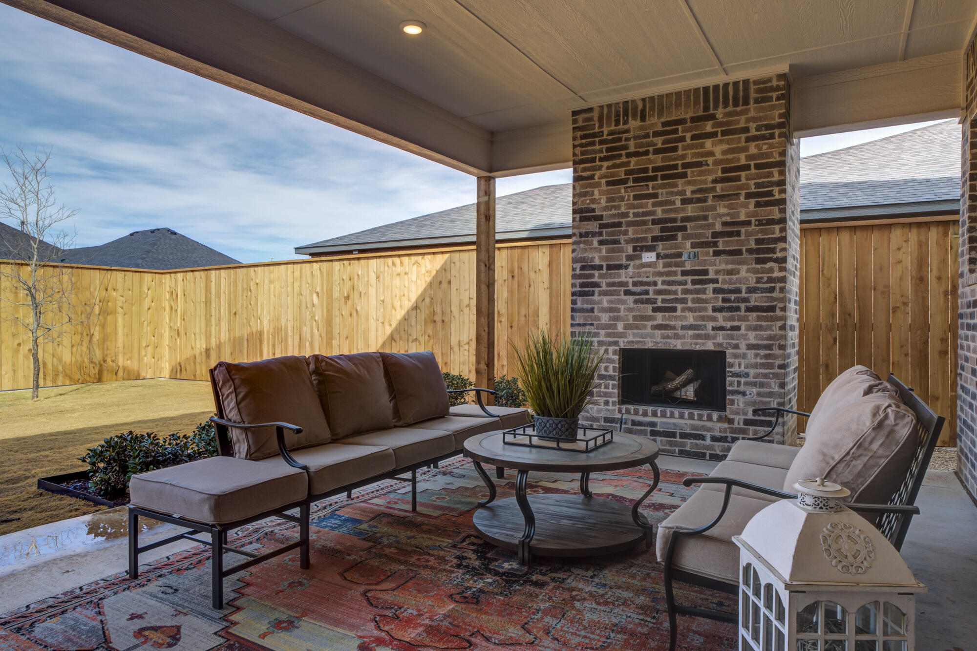 3606 144th Street Lubbock, TX 79423 - Photo 60 of 67 a living room with furniture a fireplace and a large window