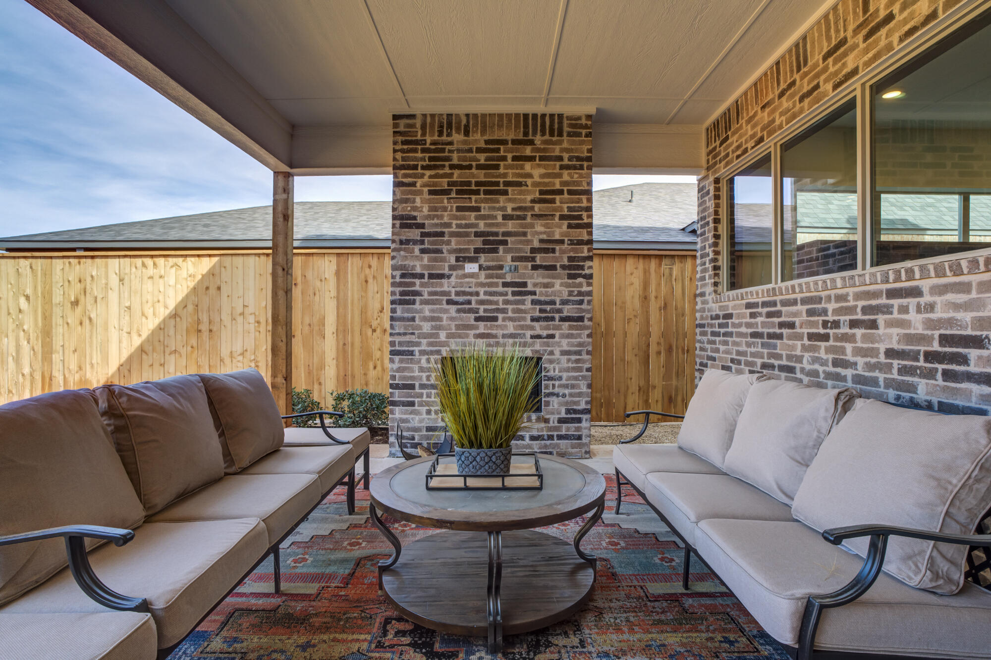 3606 144th Street Lubbock, TX 79423 - Photo 61 of 67 a living room with fireplace furniture and a potted plant