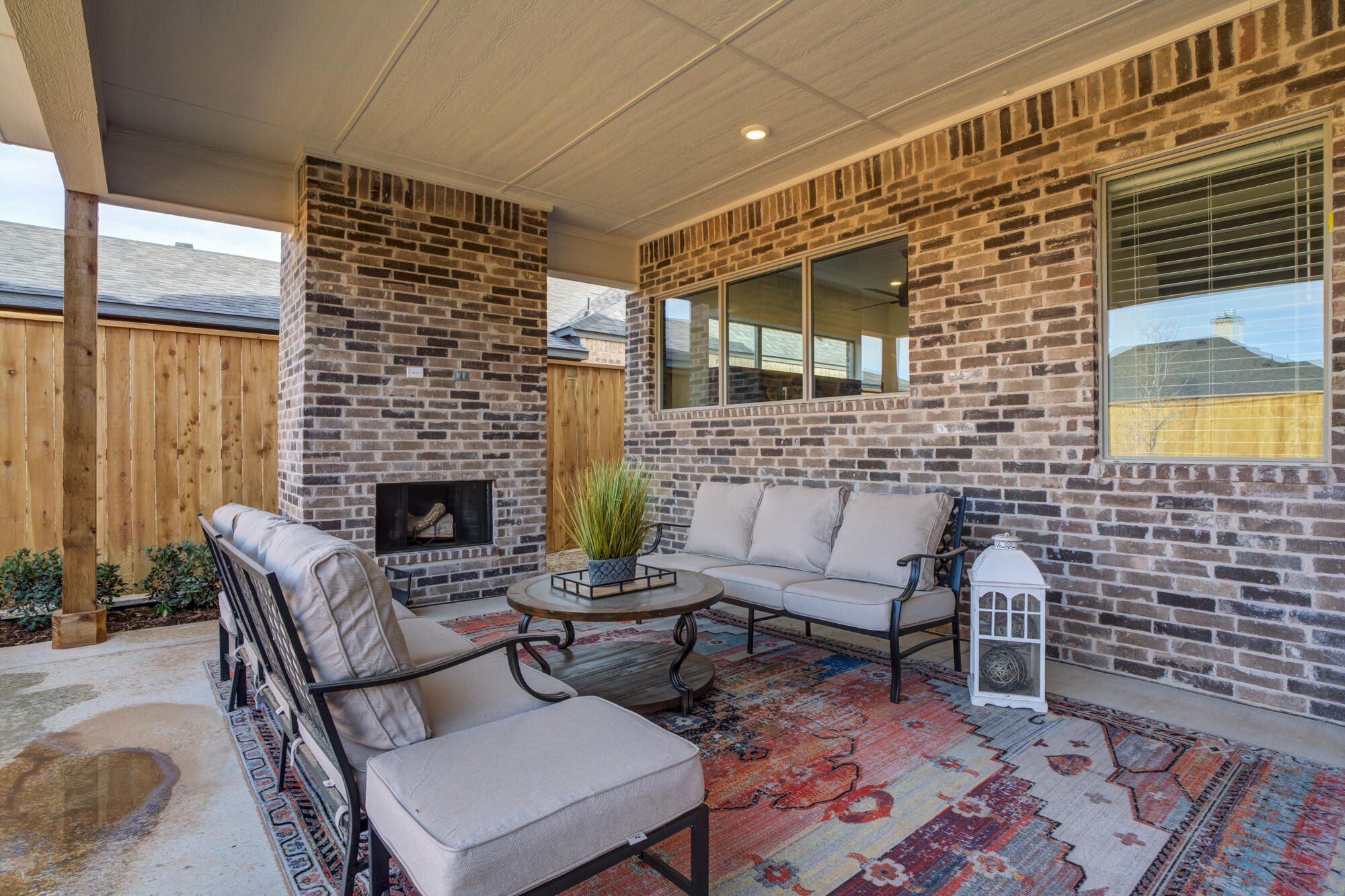 3606 144th Street Lubbock, TX 79423 - Photo 62 of 67 a outdoor living space with furniture and a fireplace