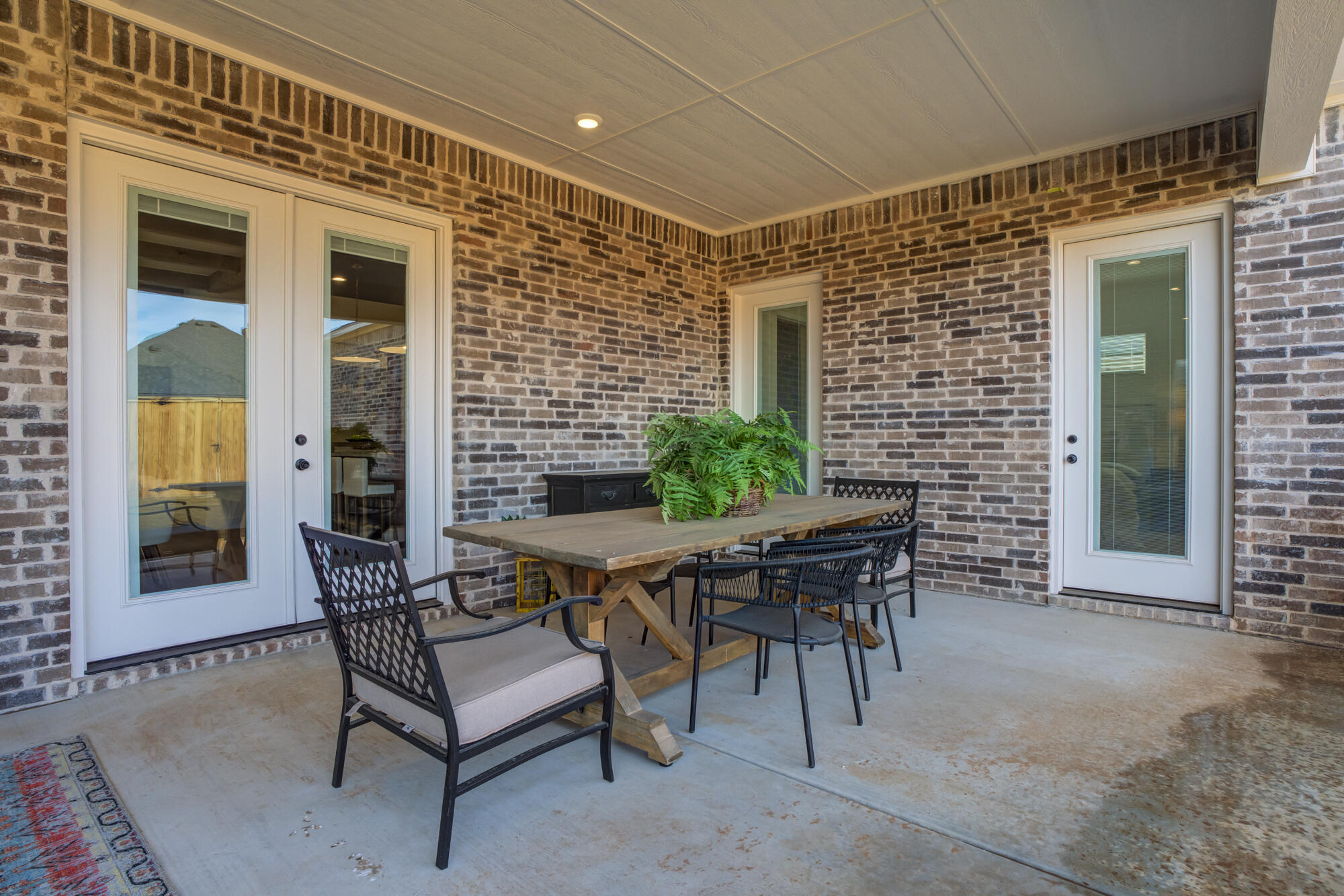 3606 144th Street Lubbock, TX 79423 - Photo 63 of 67 a view of a patio with a table and chairs