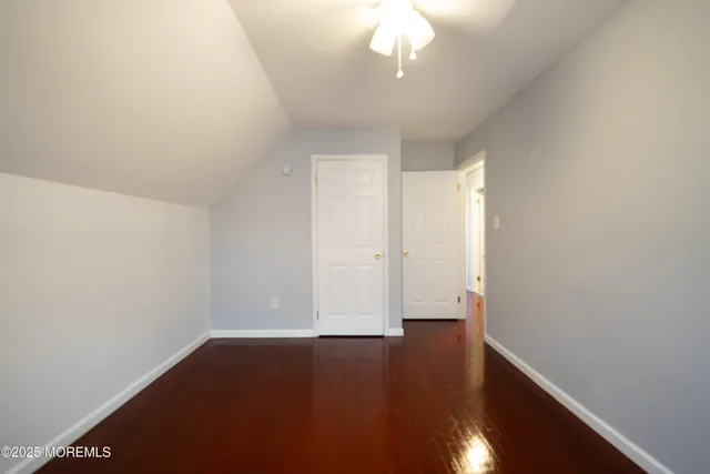 a front view of a house with a garden and plants