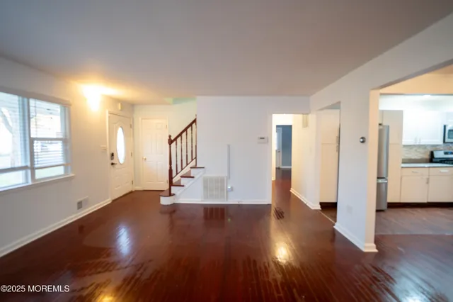 a kitchen with a refrigerator and a sink
