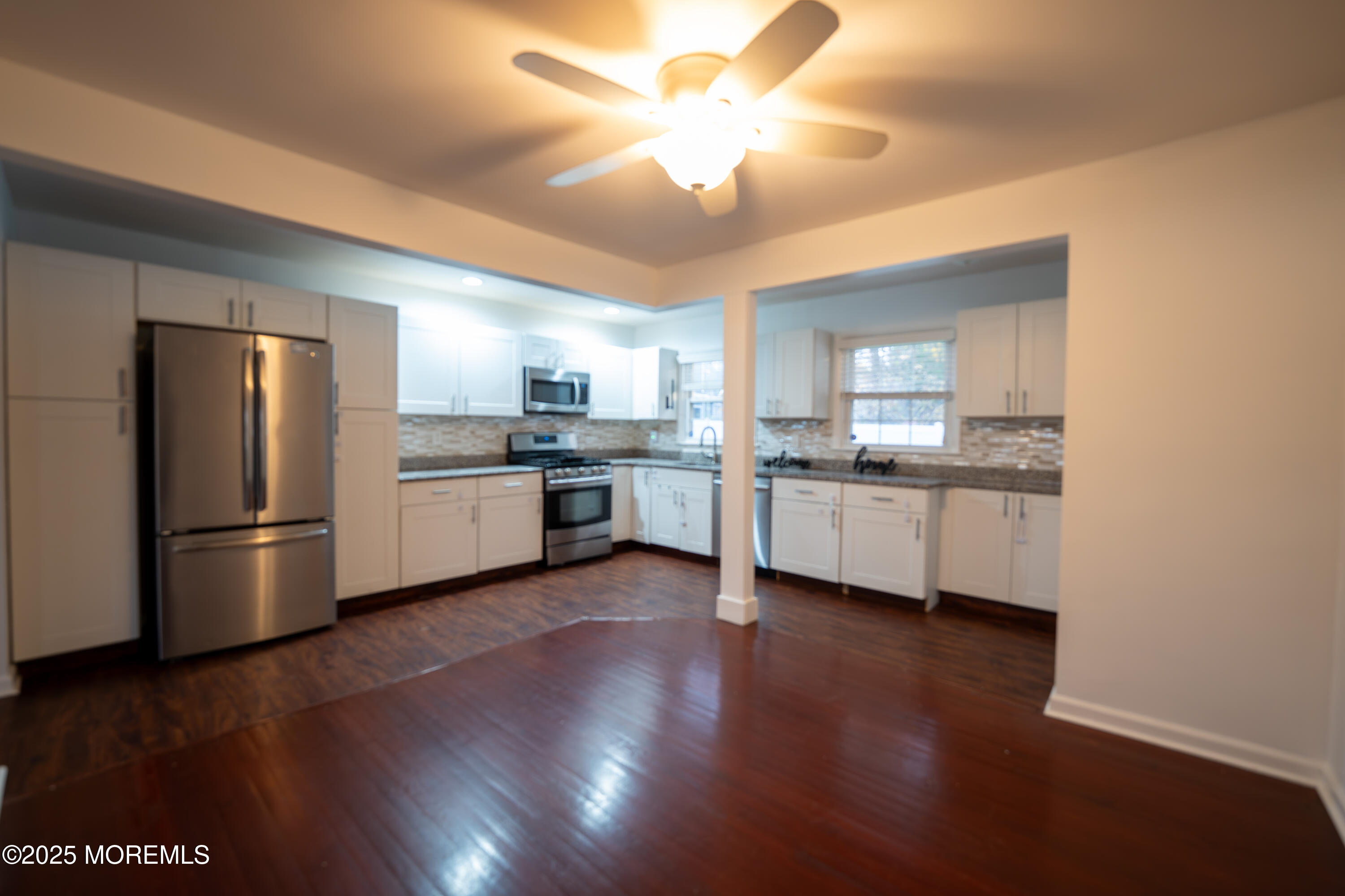 813 Raleigh Drive Toms River, NJ 08753 - Photo 7 of 28 a kitchen with a refrigerator and a sink