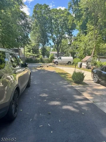a view of backyard with swimming pool and outdoor seating