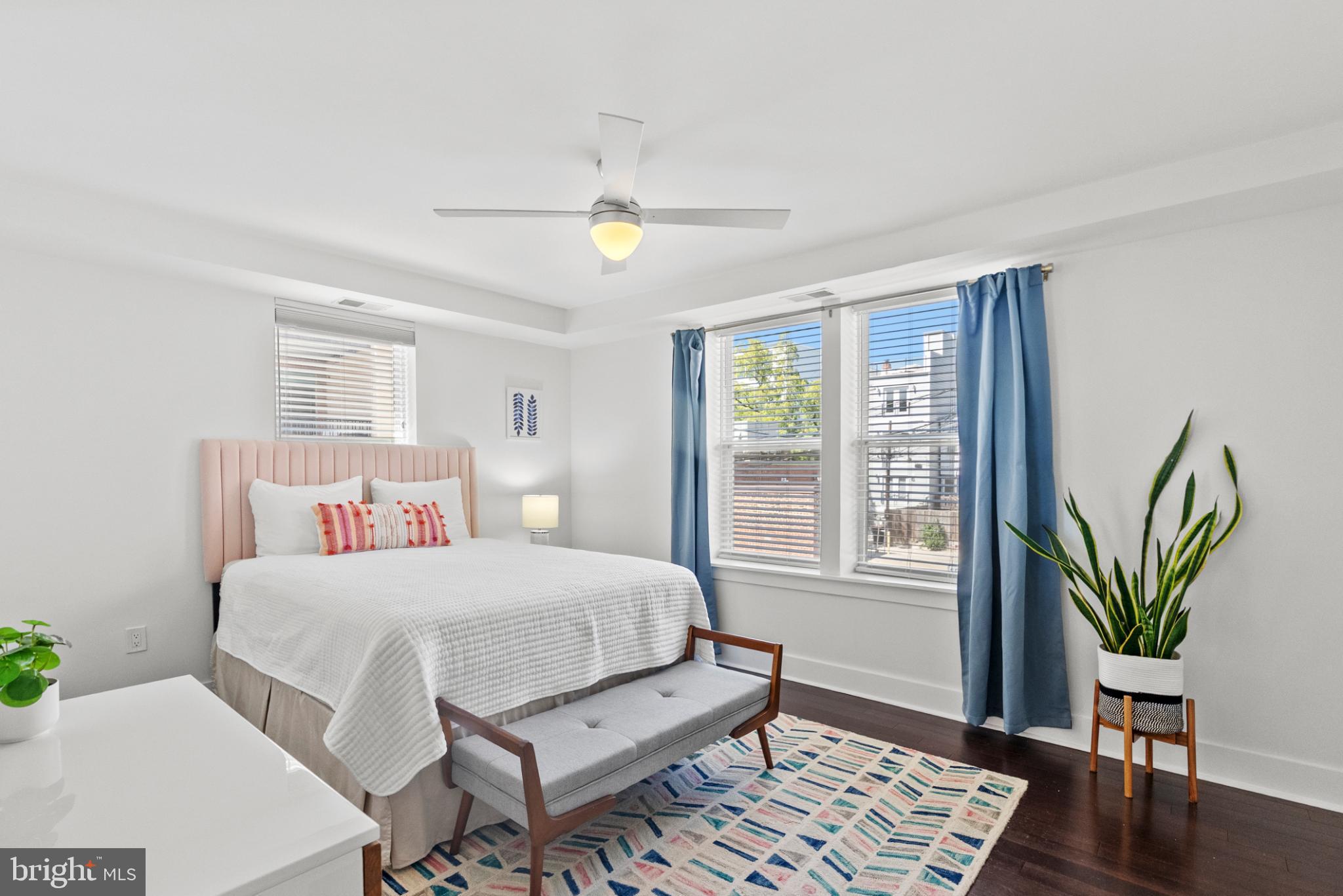 1461 Girard Street Northwest, Unit 201 Washington, DC 20009 - Photo 13 of 24 a bedroom with a bed and wooden floor