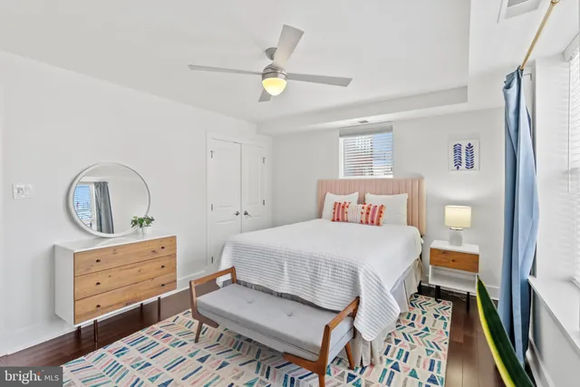 a bedroom with a bed and a dresser