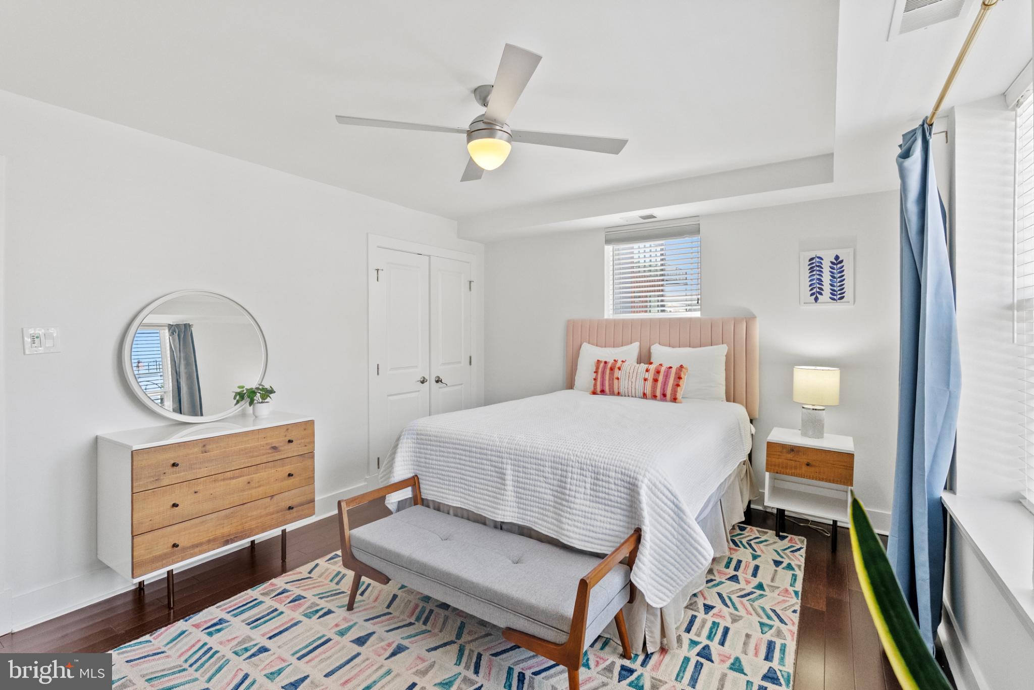 1461 Girard Street Northwest, Unit 201 Washington, DC 20009 - Photo 14 of 24 a bedroom with a bed and a dresser