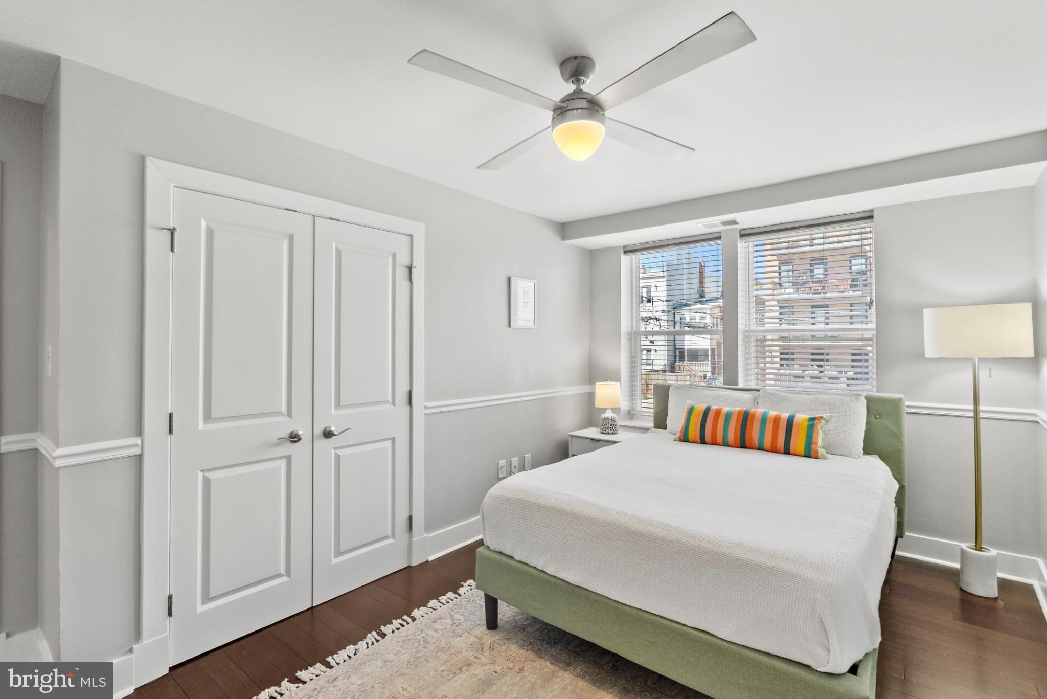 1461 Girard Street Northwest, Unit 201 Washington, DC 20009 - Photo 19 of 24 a bedroom with a bed and a chandelier