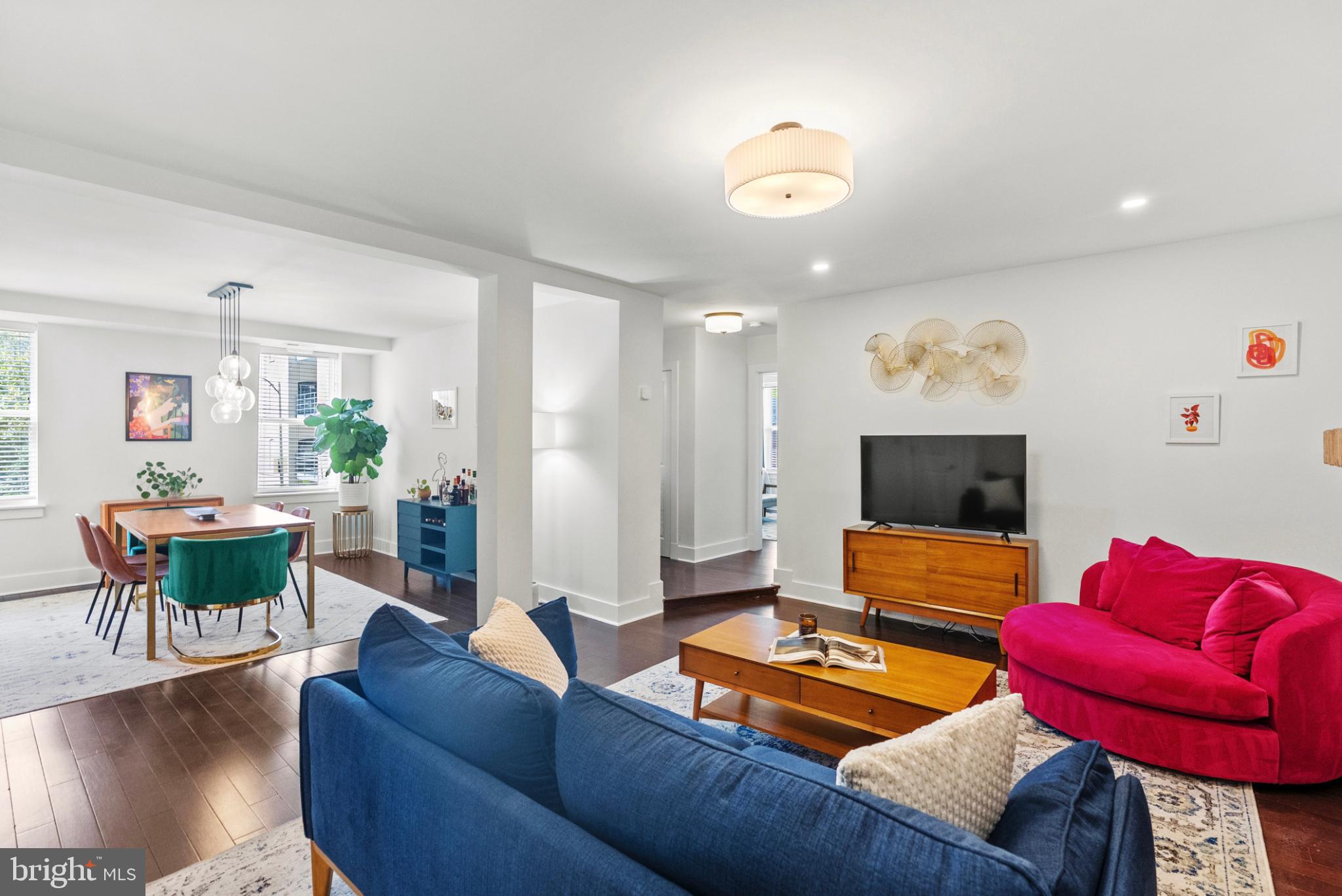 1461 Girard Street Northwest, Unit 201 Washington, DC 20009 - Photo 2 of 24 a living room with furniture and a flat screen tv