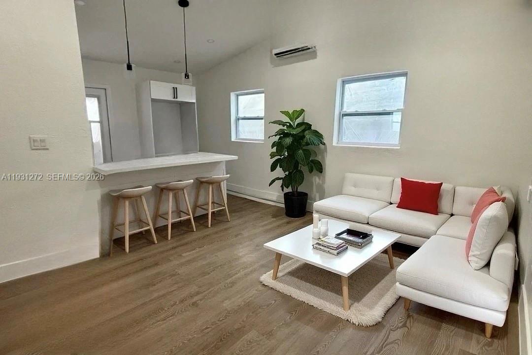 2838 Northwest 4th Street Pompano Beach, FL 33069 - Photo 2 of 10 a living room with furniture and a wooden floor