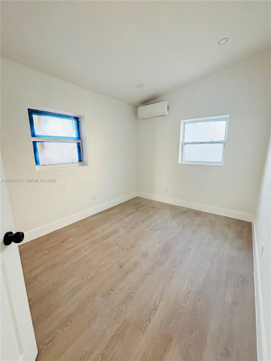 2838 Northwest 4th Street Pompano Beach, FL 33069 - Photo 8 of 10 an empty room with a workbench