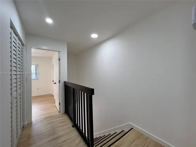 a view of kitchen with sink microwave and stove