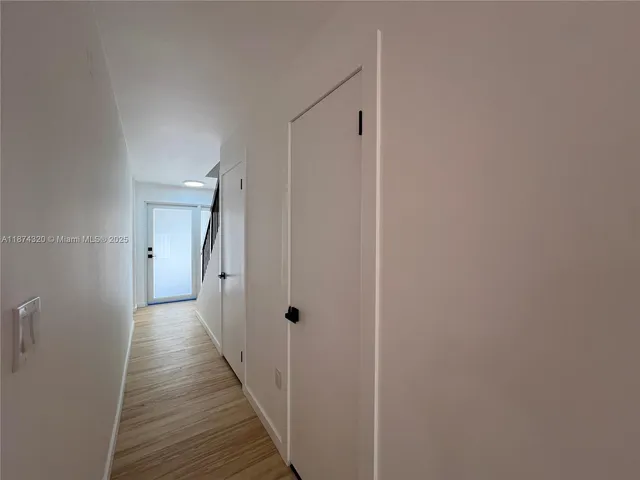 a bathroom with a toilet sink and vanity