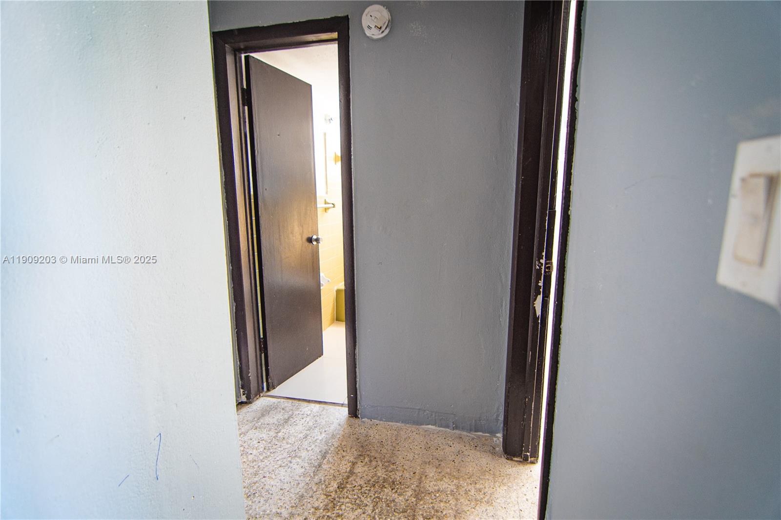 2000 Northwest 29th Street, Unit 1 Miami, FL 33142 - Photo 6 of 9 a view of a bathroom with a glass door and a window