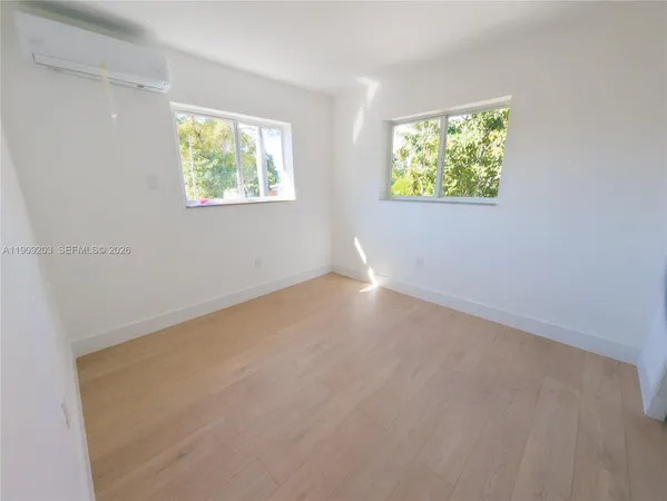 an empty room with windows