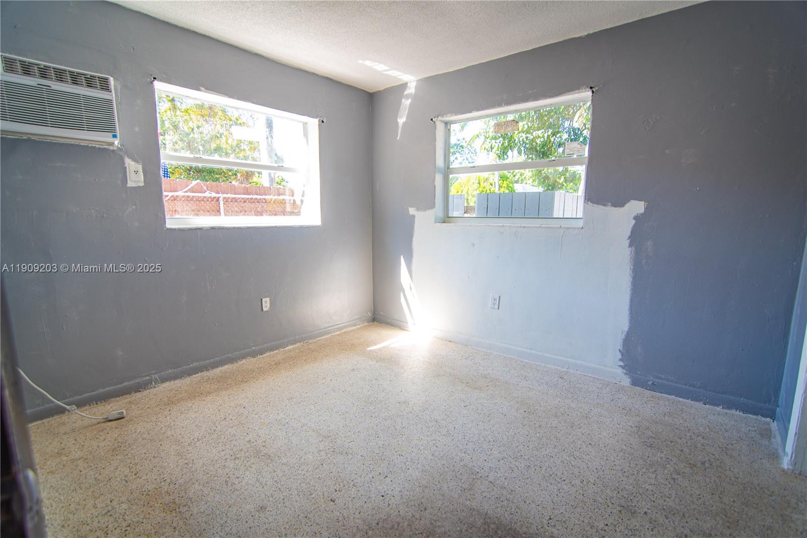 2000 Northwest 29th Street, Unit 1 Miami, FL 33142 - Photo 7 of 9 a view of room with window