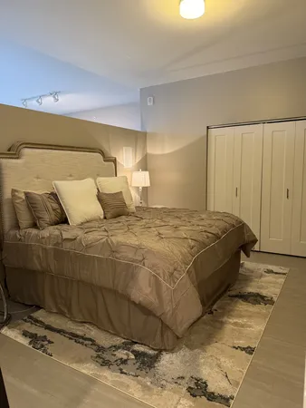 a bedroom with a bed and a shower
