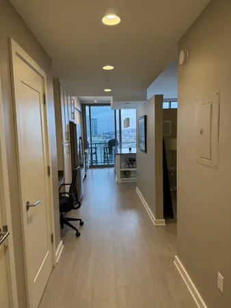 a view of a kitchen with refrigerator and chair
