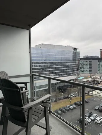 a view of a balcony with chairs