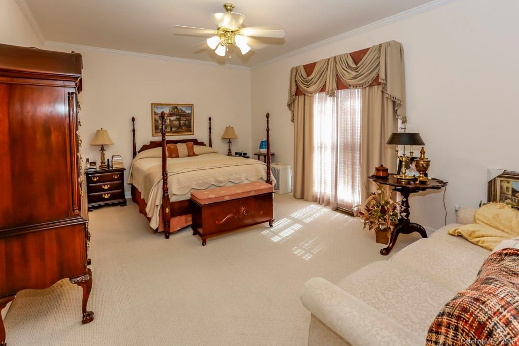 321 Ridgeview Drive Rutherfordton, NC 28139 - Photo 12 of 25 a living room with a bed furniture and a chandelier