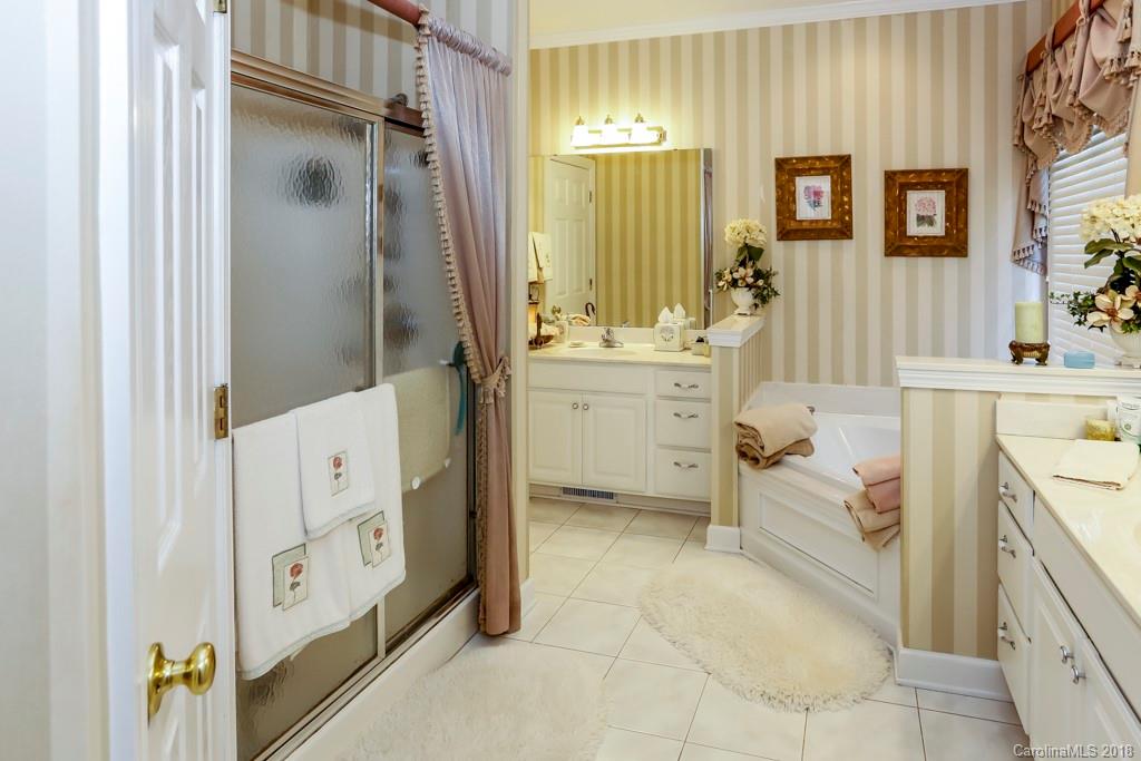 321 Ridgeview Drive Rutherfordton, NC 28139 - Photo 14 of 25 a bathroom with a sink a mirror and a bathtub