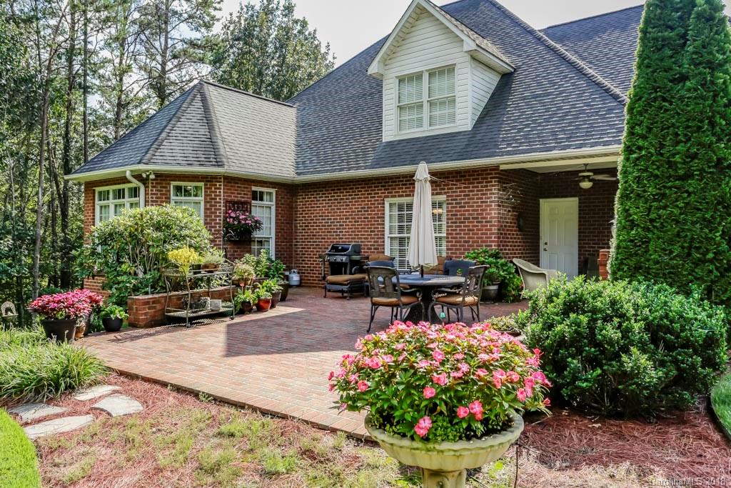 321 Ridgeview Drive Rutherfordton, NC 28139 - Photo 21 of 25 a front view of a house with a yard and a garden