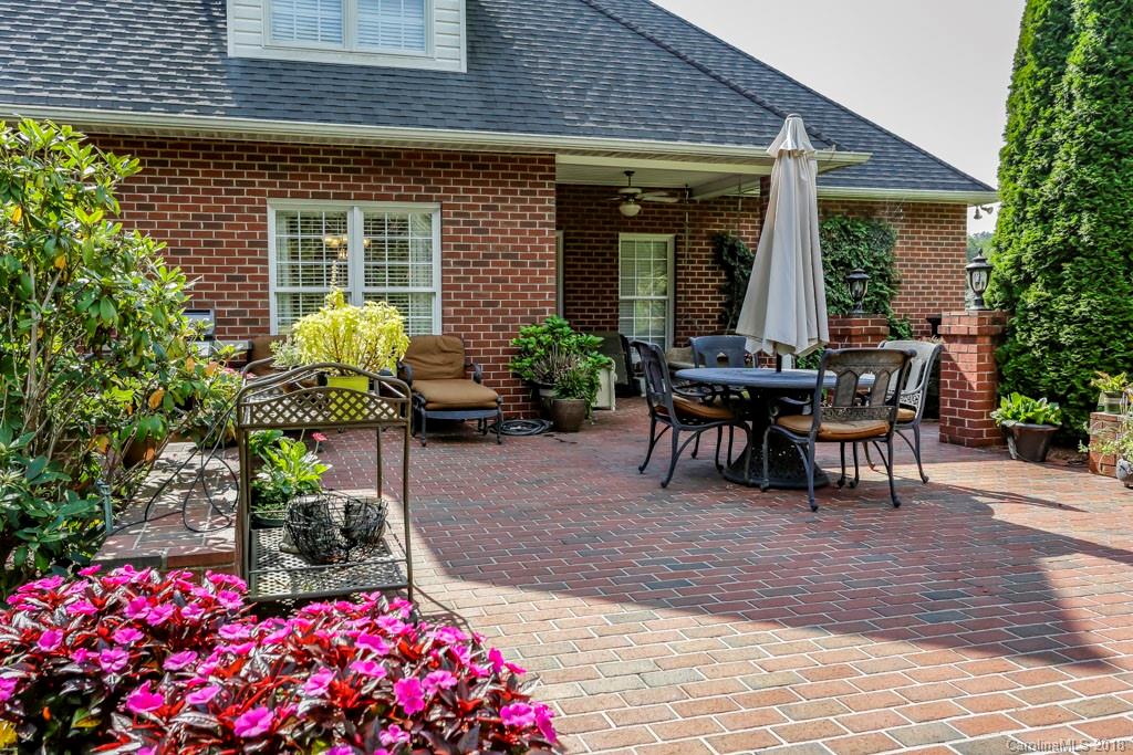 321 Ridgeview Drive Rutherfordton, NC 28139 - Photo 24 of 25 a view of a patio with table and chairs and potted plants