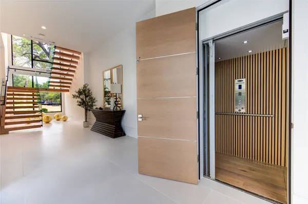 a view of an empty room and a balcony