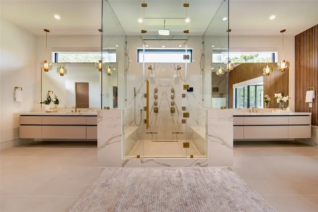 a bathroom with a tub a shower and a sink