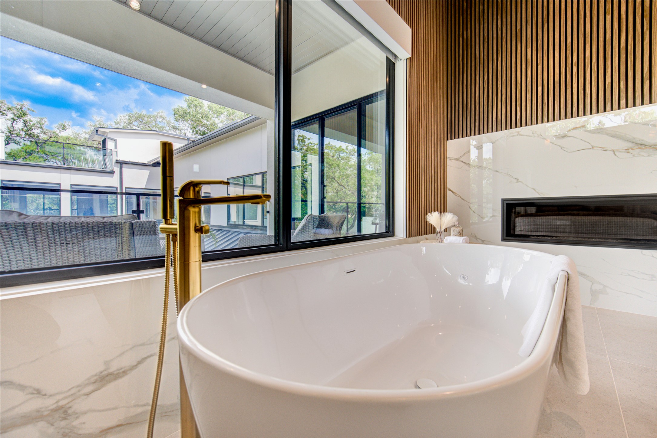 2006 Suffolk Drive Houston, TX 77027 - Photo 16 of 29 a white bath tub sitting in front of a window