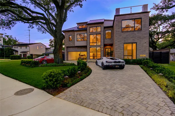 a car parked in front of a brick building