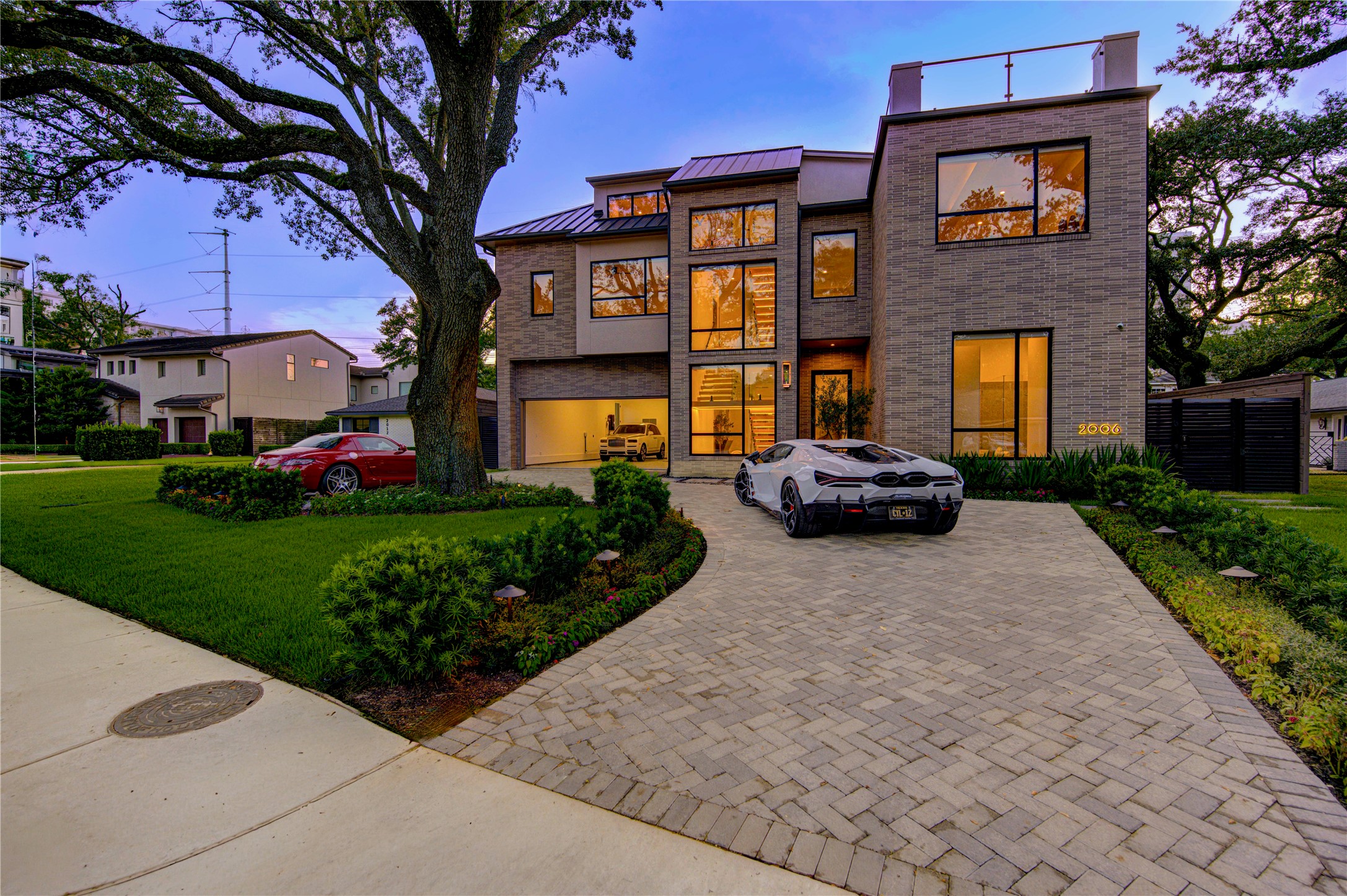 2006 Suffolk Drive Houston, TX 77027 - Photo 2 of 29 a car parked in front of a brick building