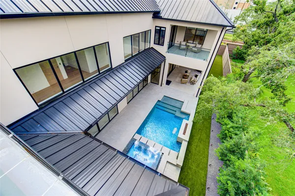 a view of balcony with wooden floor and fence