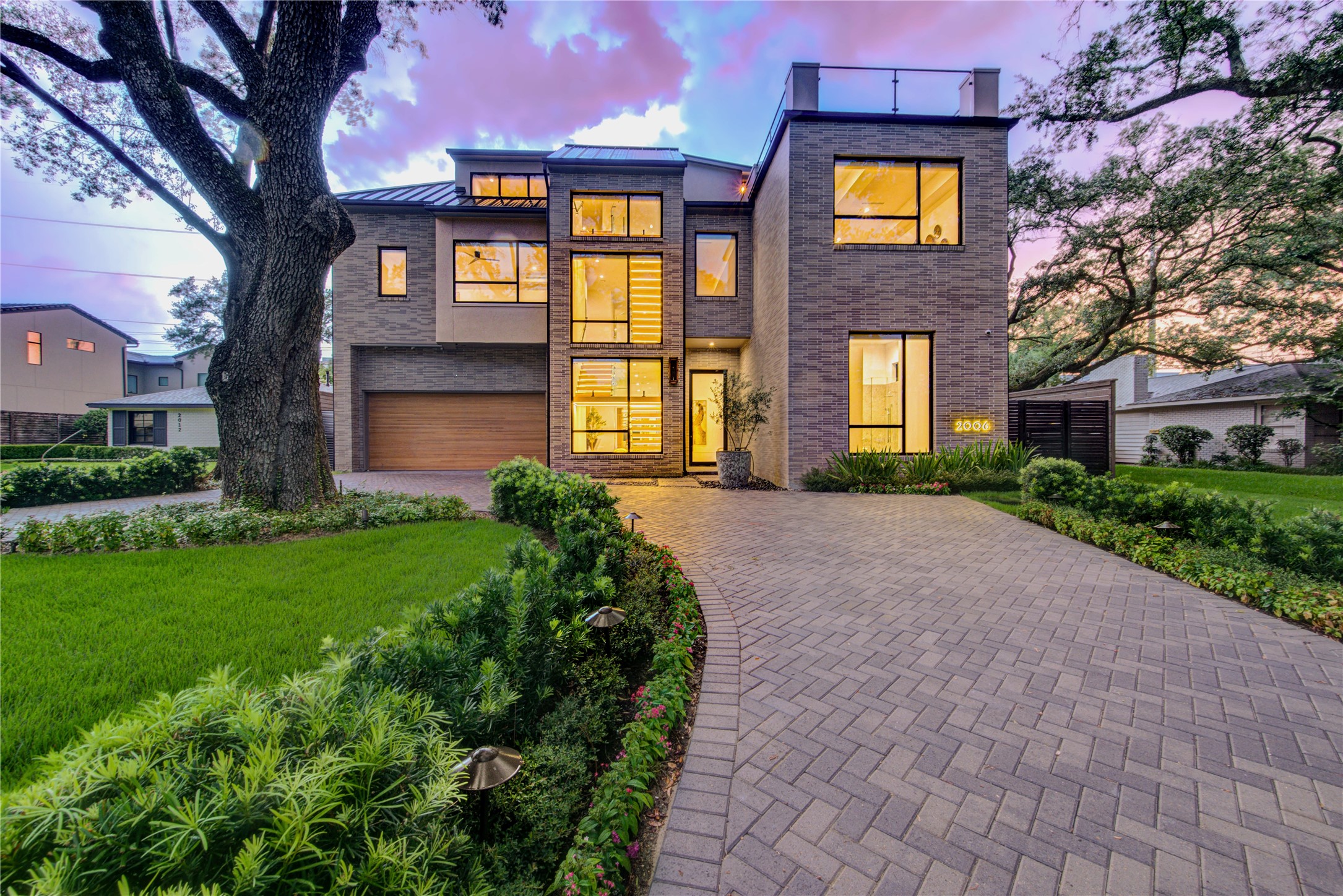 2006 Suffolk Drive Houston, TX 77027 - Photo 29 of 29 a front view of a house with garden and trees