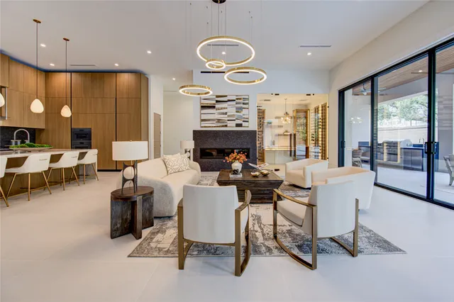 a view of a livingroom with furniture and a large window