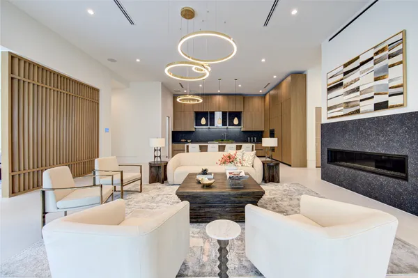 a kitchen with a table chairs and a fireplace