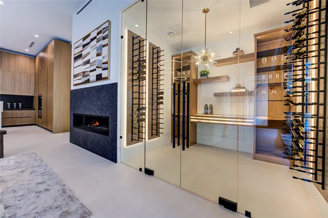 a kitchen with stainless steel appliances kitchen island granite countertop a refrigerator and a stove top oven