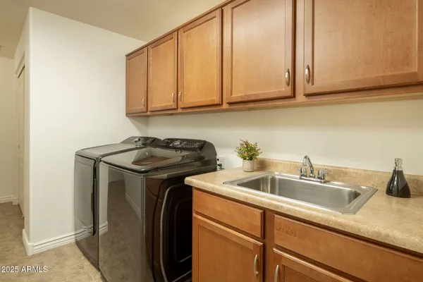 a kitchen with stainless steel appliances granite countertop white cabinets a sink and dishwasher