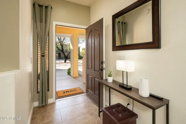 a view of a hallway with a door and couch