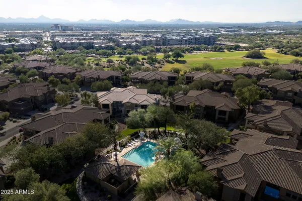 an aerial view of multiple houses with outdoor space