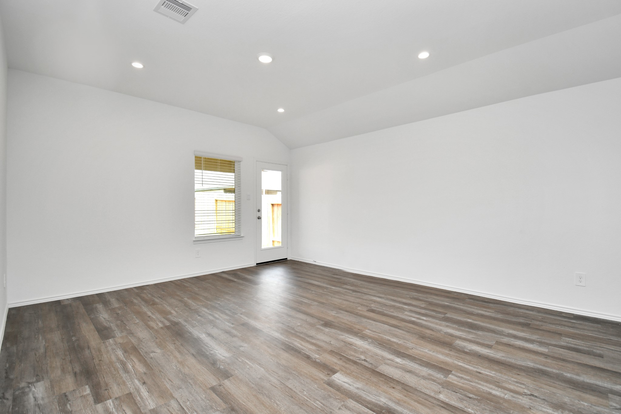 5315 Castlebury Meadows Dr Spring Spring, TX 77373 - Photo 17 of 39 an empty room with wooden floor and windows