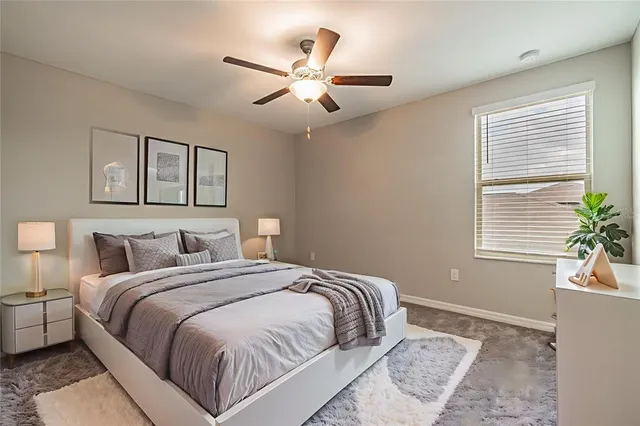 a bedroom with bed and window