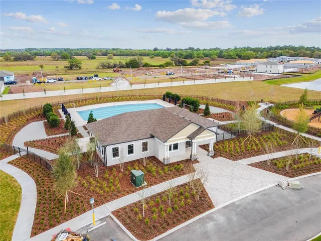a view of a swimming pool with a table and chairs