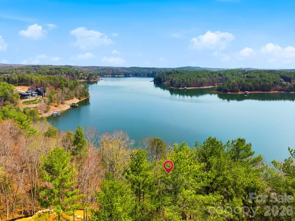 an aerial view of a houses with ocean view