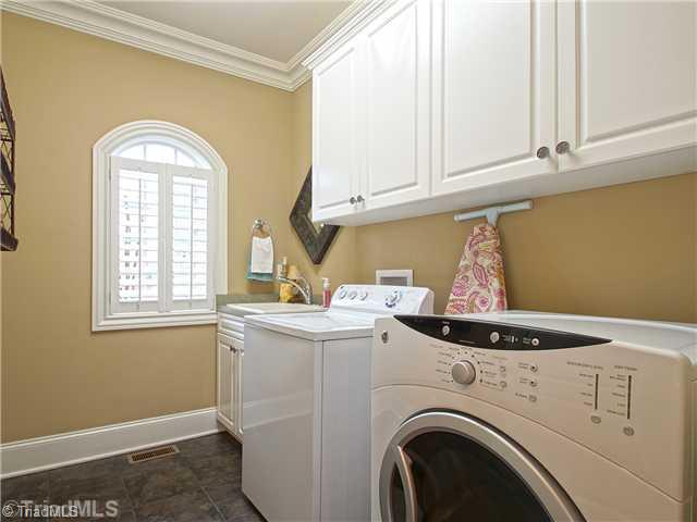 8500 Crested Oak Court Oak Ridge, NC 27310 - Photo 8 of 16 Laundry Room. On the man level, you will also find the beautifully appointed powder room and an oversized laundry room.