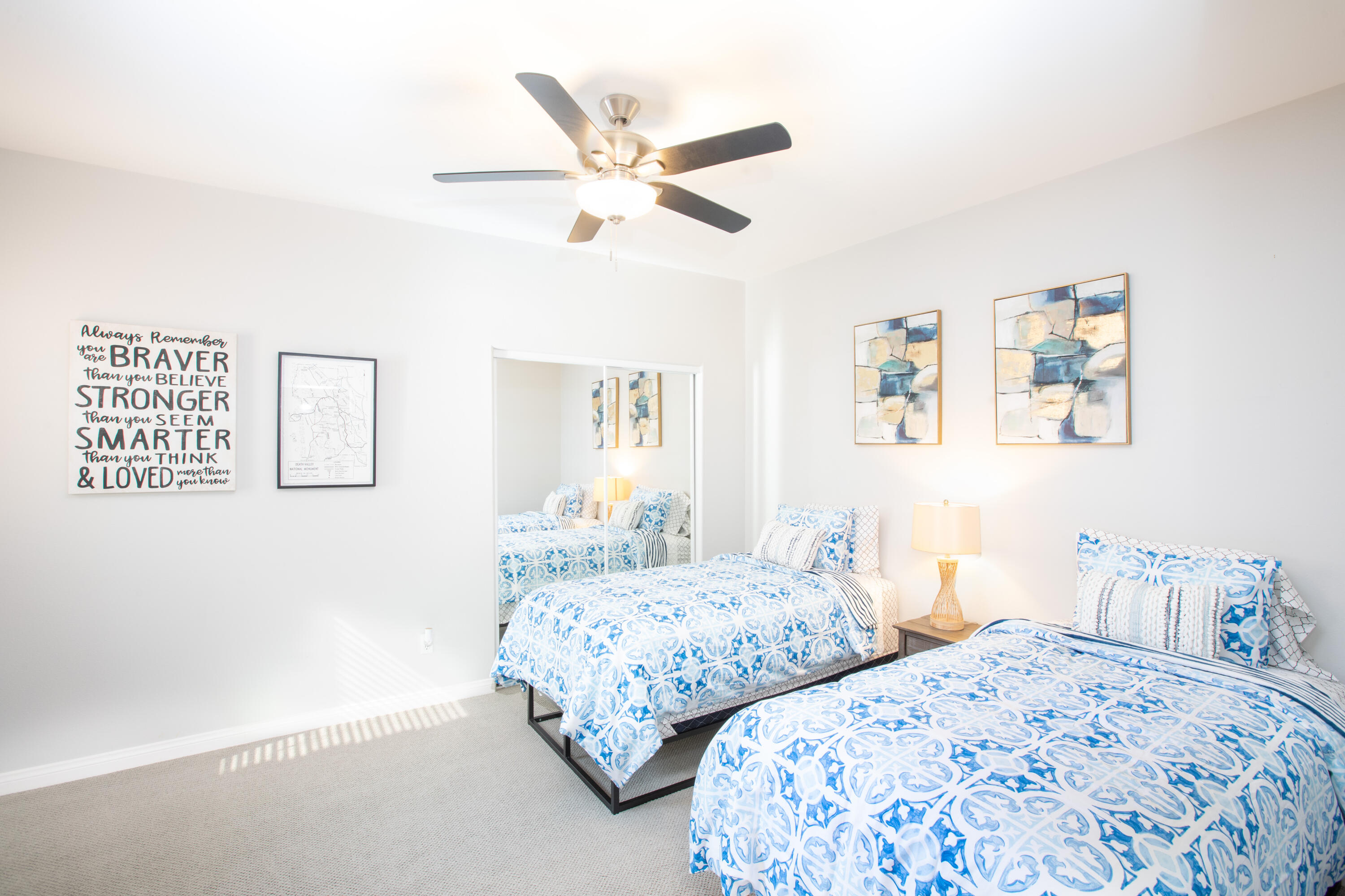 82368 Lancaster Way Indio, CA 92201 - Photo 17 of 35 a bedroom with two separate beds and painting on the wall