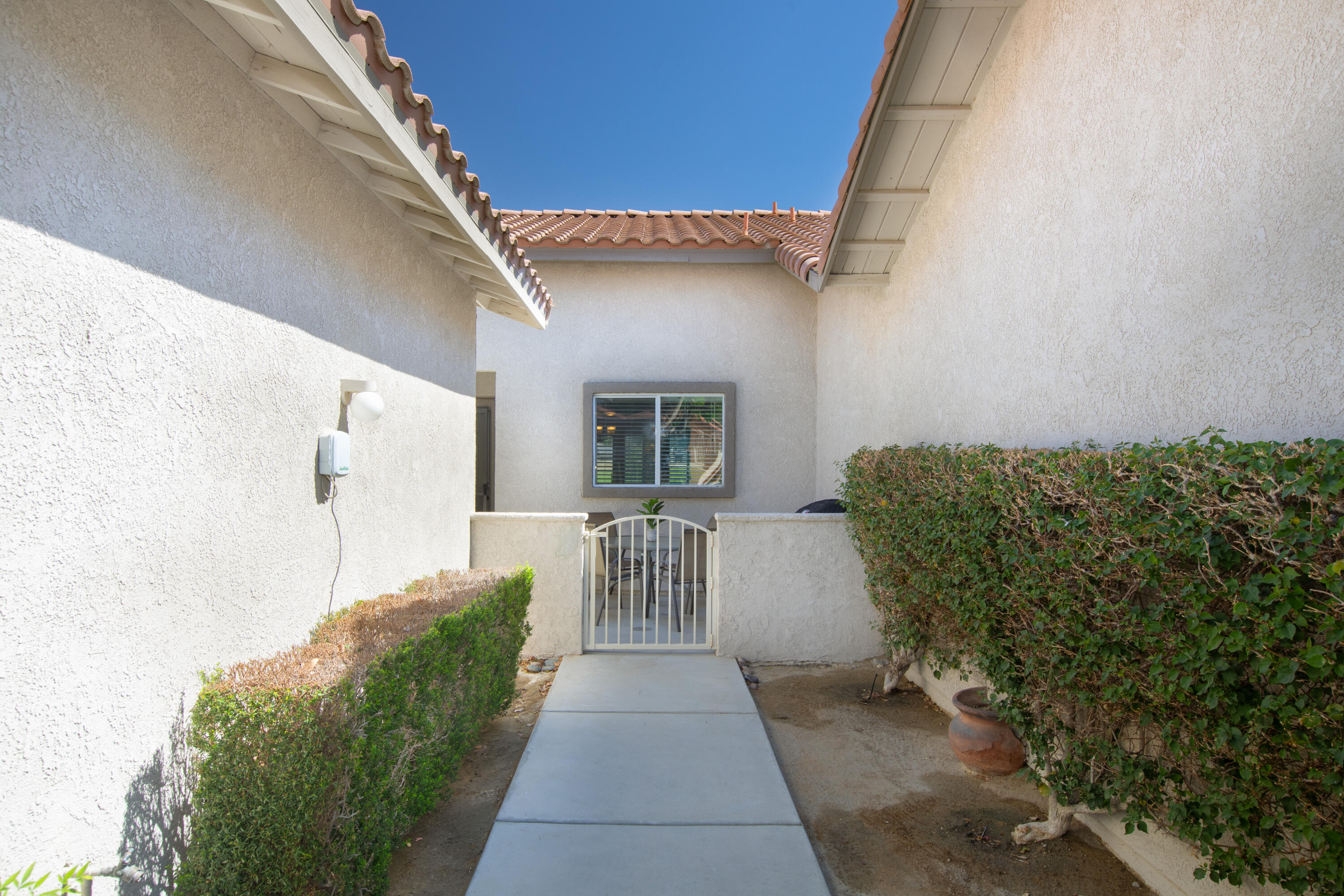 82368 Lancaster Way Indio, CA 92201 - Photo 20 of 35 a view of a house with a porch