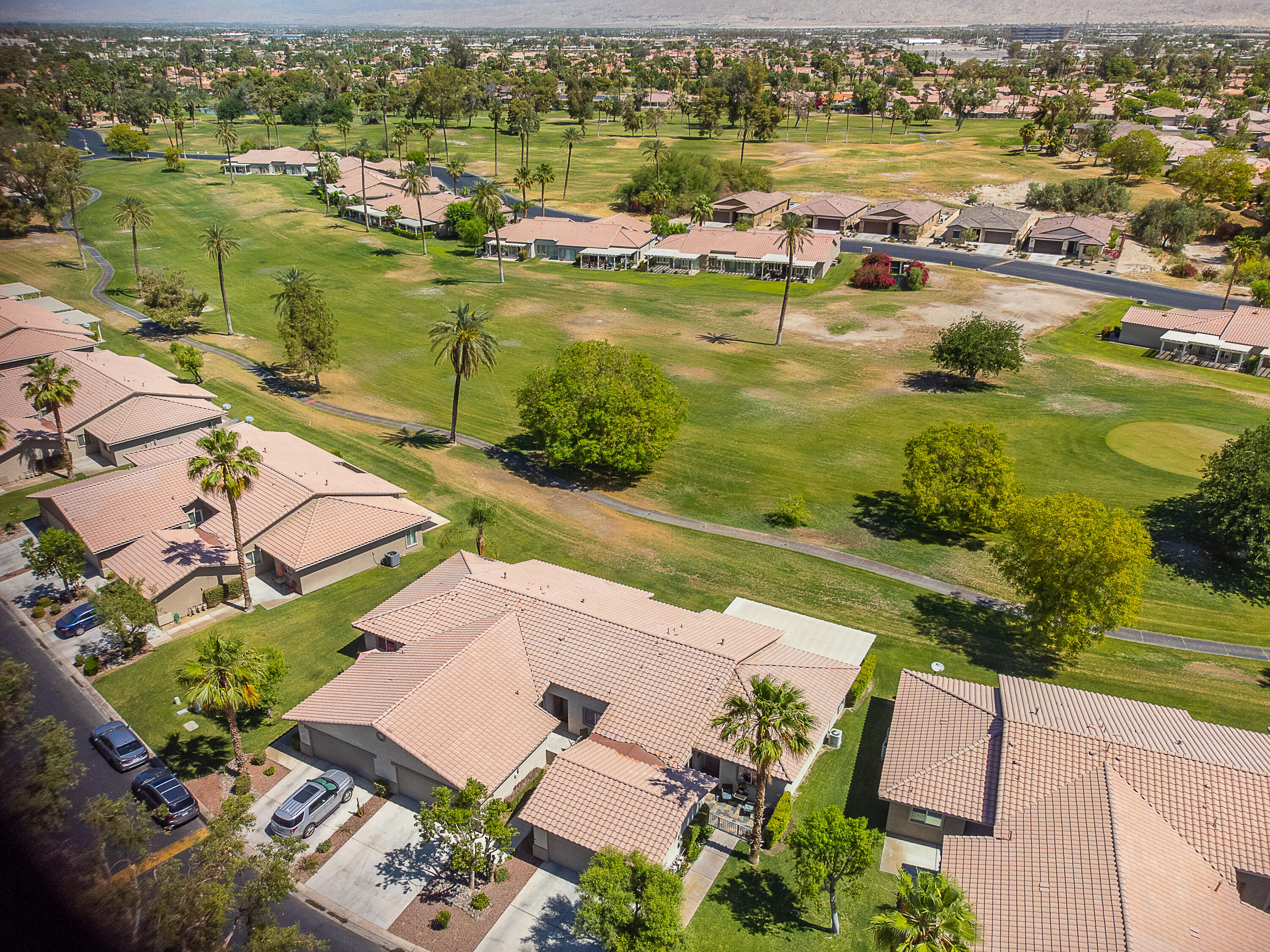 82368 Lancaster Way Indio, CA 92201 - Photo 2 of 35 an aerial view of residential houses with outdoor space